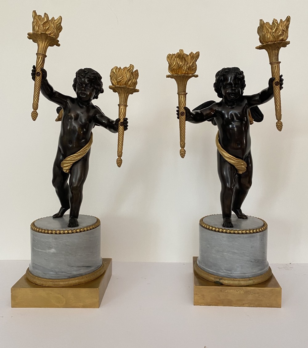 Pair of French Bronze and Gilt Bronze Putti Candelabra. Circa 1900