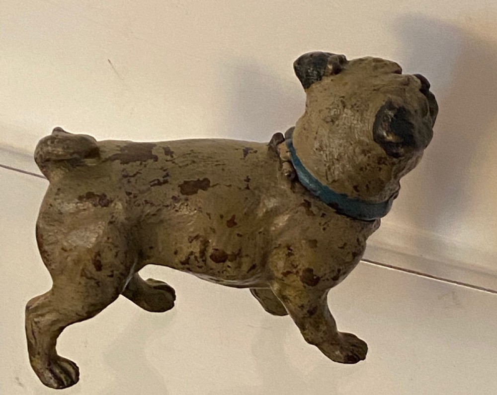 An antique cold-painted bronze desk inkwell designed in the realistic form of a standing pug dog with a blue collar. View VI