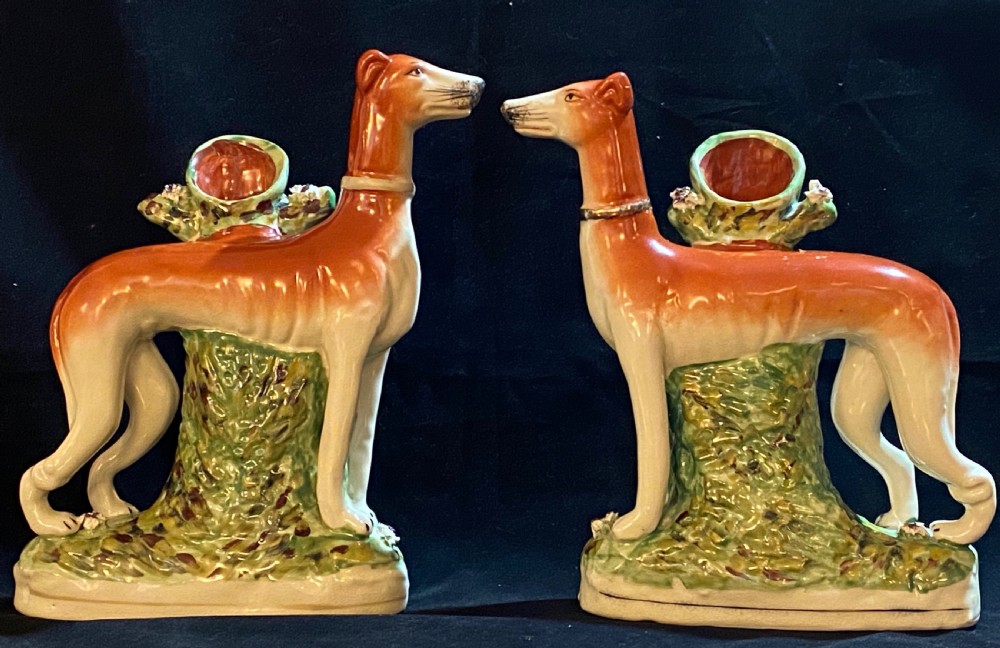 A Pair of Staffordshire Pottery Models of Greyhounds.