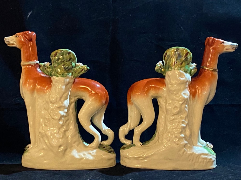 A Pair of Staffordshire Pottery Models of Greyhounds. View II