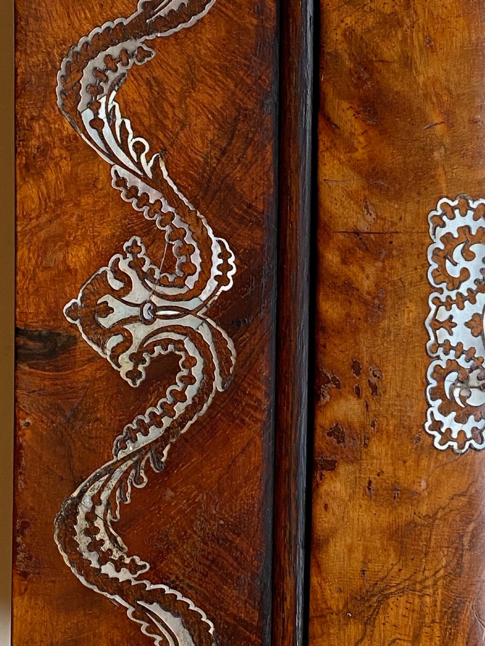 A Regency rosewood workbox with mother-of-pearl foliate inlays, side ring handles, and carved feet. View VI
