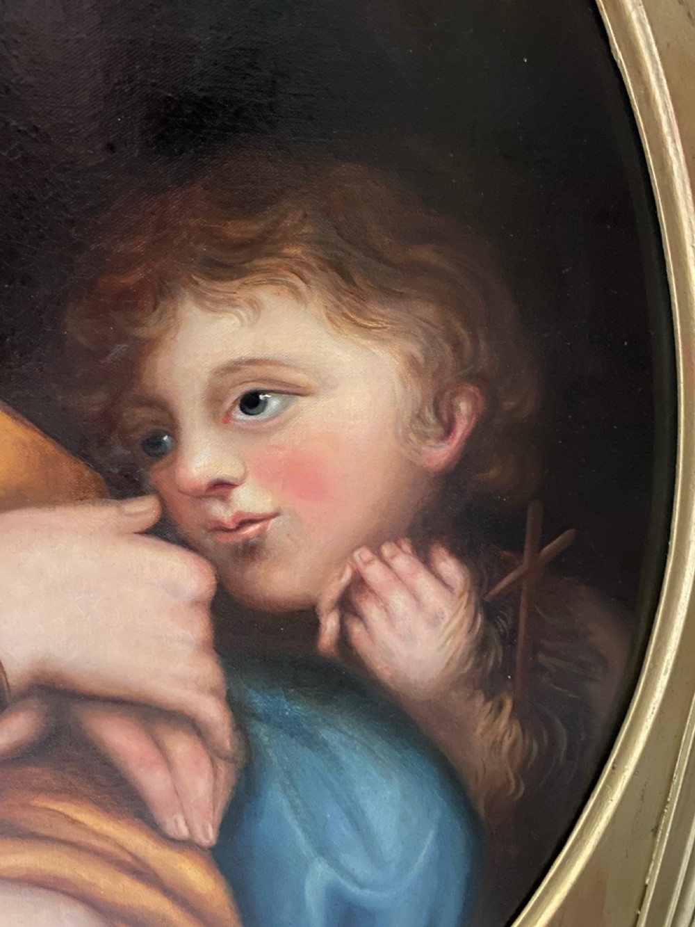 An antique square gilded frame housing a circular tondo oil painting depicting the Madonna embracing the Christ child alongside Saint John the Baptist. View V