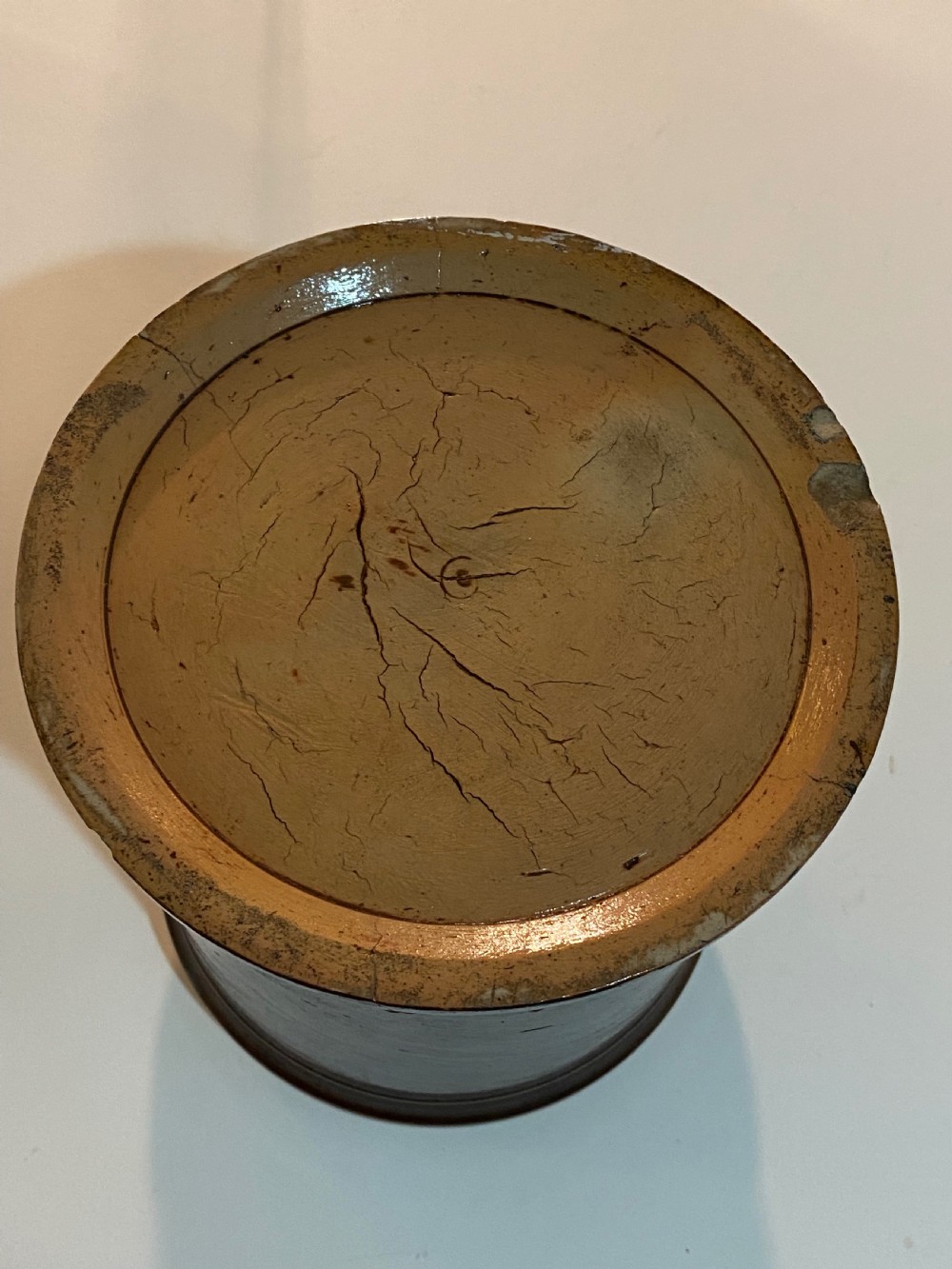 A mid-19th century brown glazed stoneware apothecary jar featuring floral relief borders and a label reading PULV AMYLI. View VIII