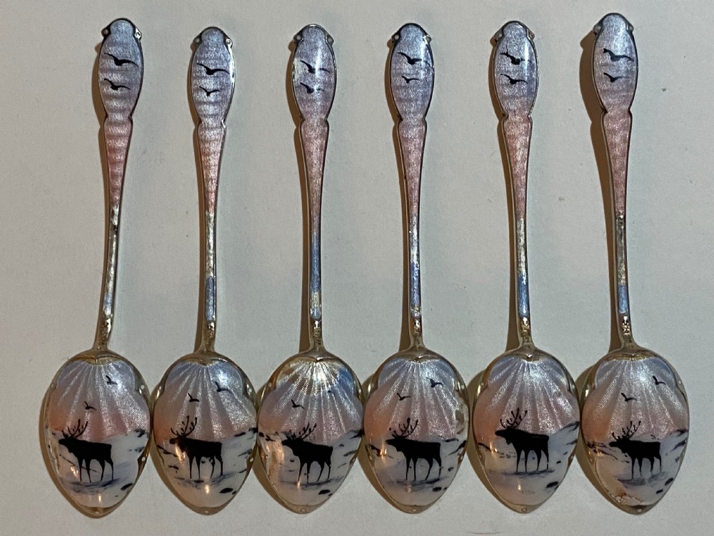 Cased Set of Norwegian Silver and Enamel Coffee Spoons, decorated with Reindeer. 