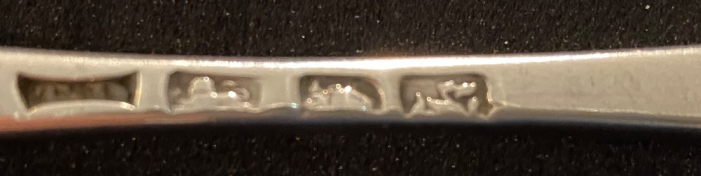 Pair of George III Silver Serving Spoons. London 1765. View III