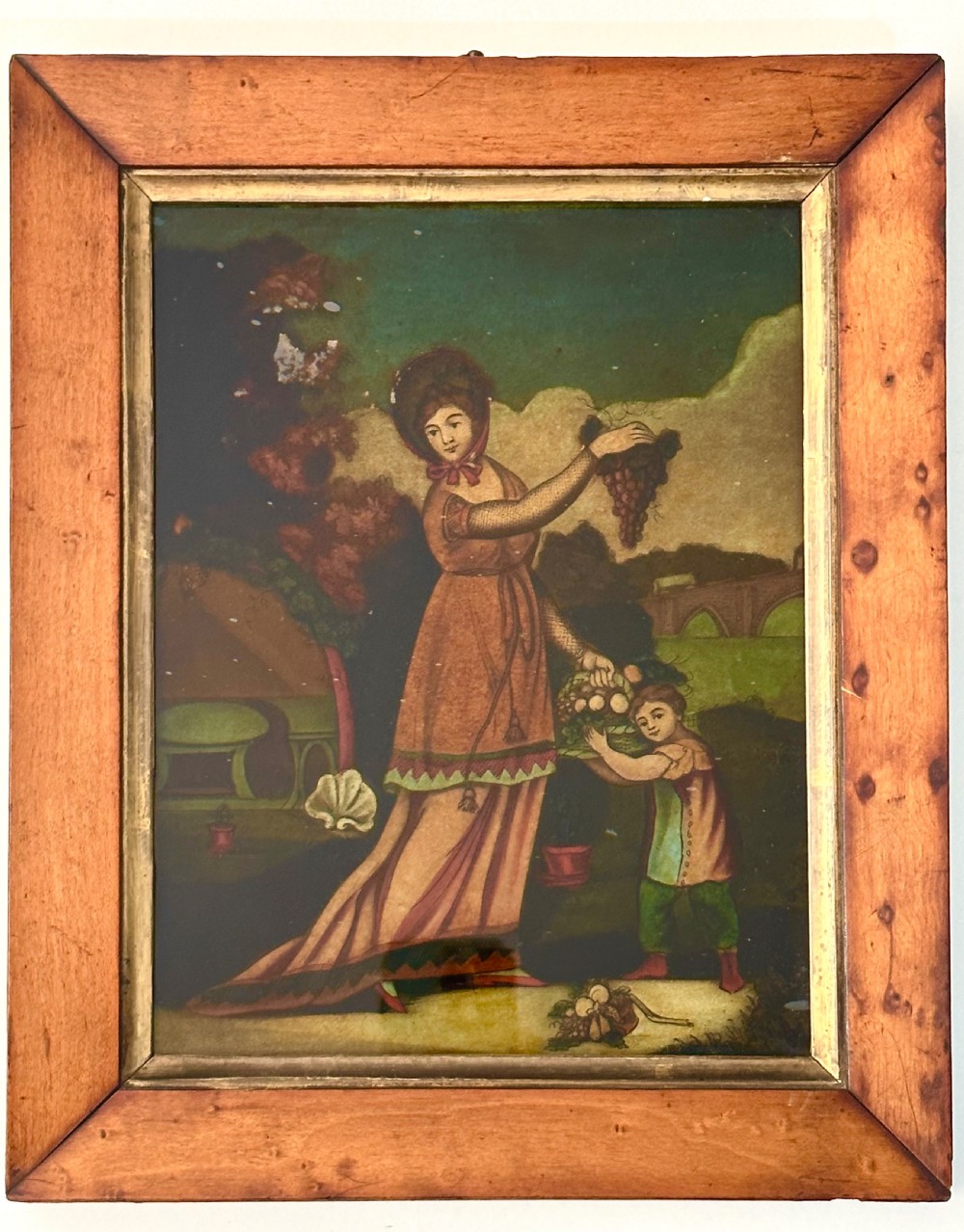 Set of four Regency reverse glass prints depicting figures representing the seasons, framed in birds-eye maple frames with gilt slips. View VI