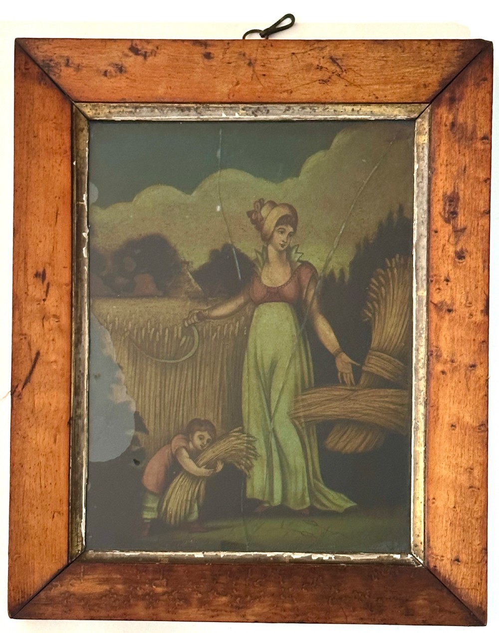 Set of four Regency reverse glass prints depicting figures representing the seasons, framed in birds-eye maple frames with gilt slips. View VIII