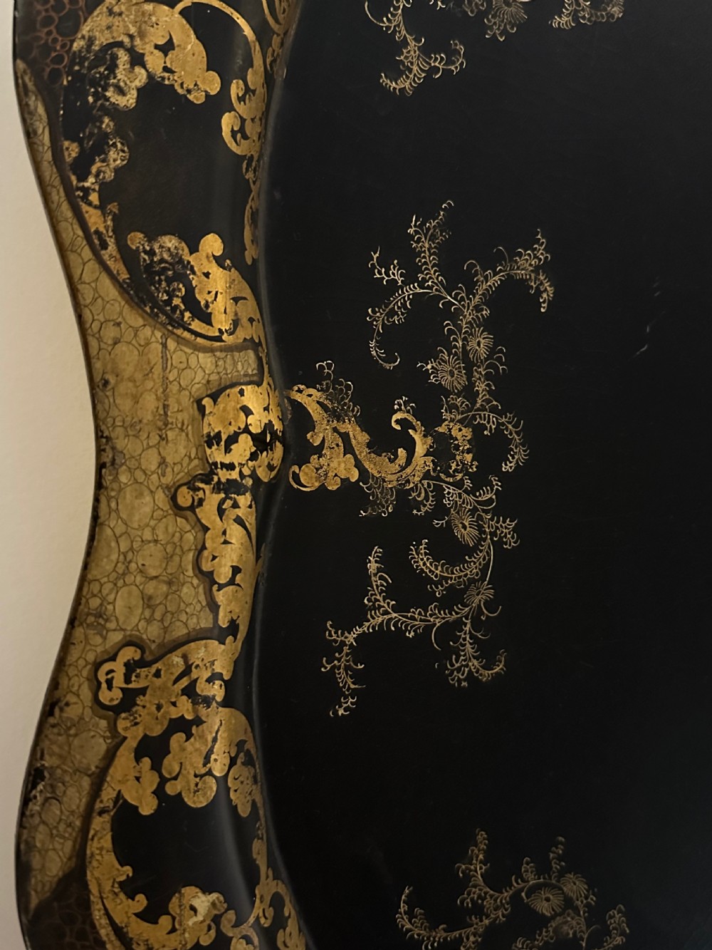 Large Victorian black papier-mache tray by Jennens and Bettridge featuring scalloped edges and detailed gilt scrollwork. View III
