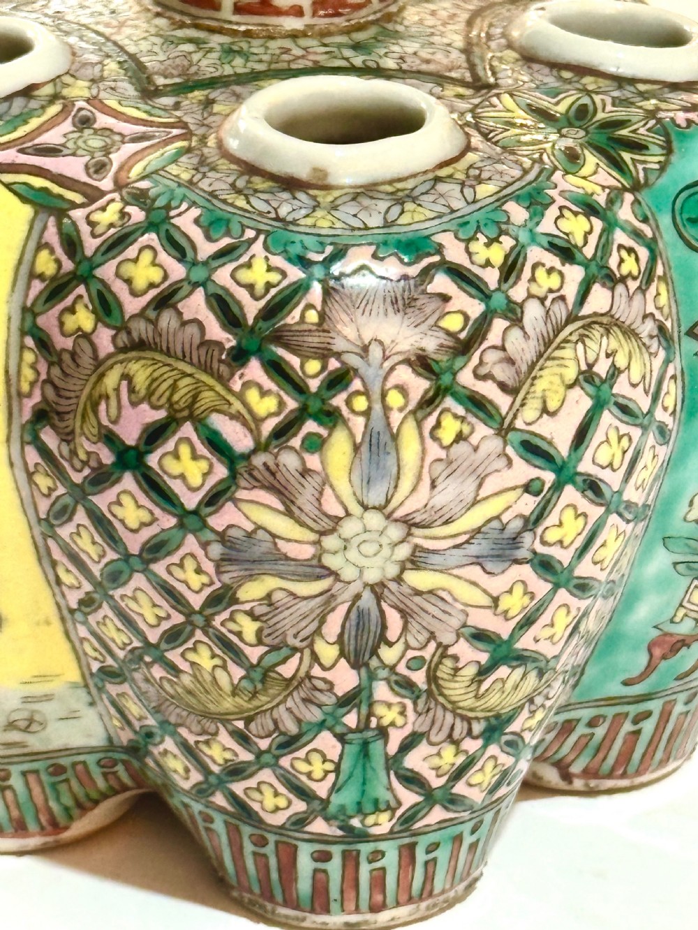 A Chinese polychrome porcelain tulip vase featuring multiple stem apertures, a central neck topped with a lotus bud, and hand-painted panels depicting birds and floral motifs. View VI