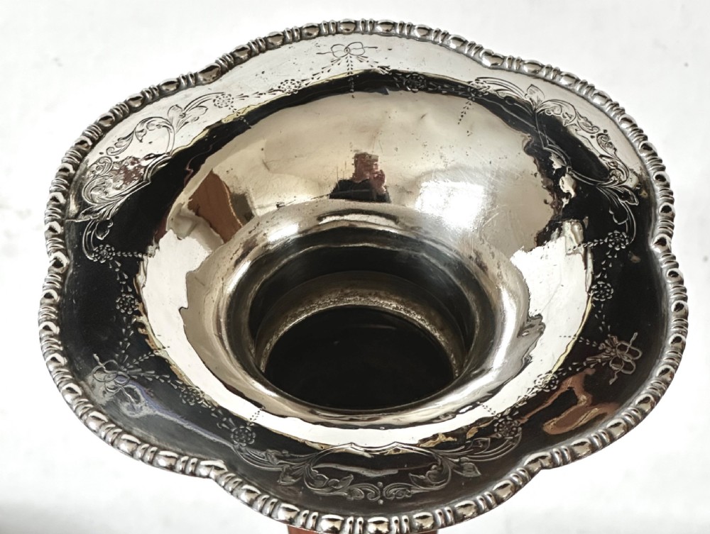 A silver-plated four-trumpet epergne table centrepiece featuring a central flared vase and three smaller removable side vases on a scrolled base. View III