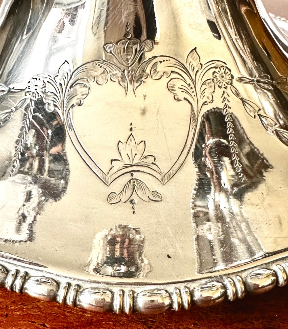 A silver-plated four-trumpet epergne table centrepiece featuring a central flared vase and three smaller removable side vases on a scrolled base. View IV
