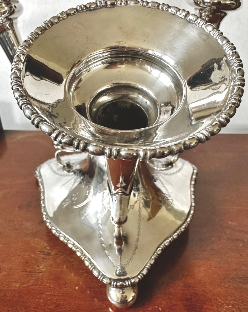 A silver-plated four-trumpet epergne table centrepiece featuring a central flared vase and three smaller removable side vases on a scrolled base. View VI