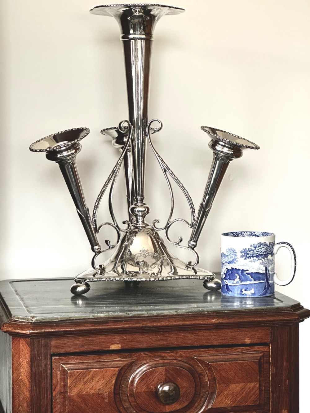 A silver-plated four-trumpet epergne table centrepiece featuring a central flared vase and three smaller removable side vases on a scrolled base. View XIV
