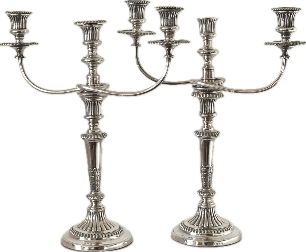 Pair of Regency Silver Candlesticks, Sheffield 1816, with matching silver plate 3-branch candelabra extensions.