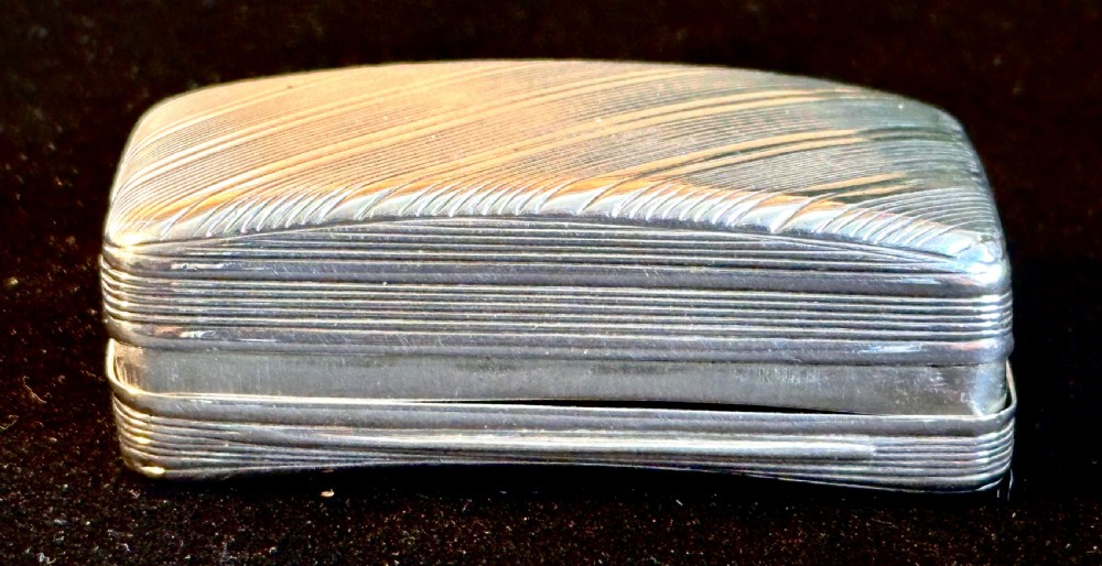 A rectangular antique silver snuff box featuring diagonal engine-turned reeding and a central unengraved rectangular cartouche. View VI