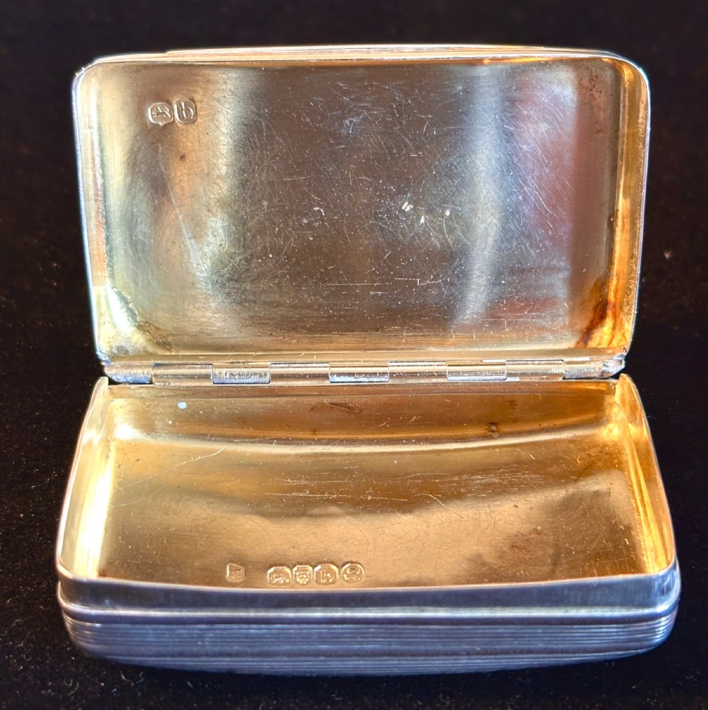 A rectangular antique silver snuff box featuring diagonal engine-turned reeding and a central unengraved rectangular cartouche. View VIII