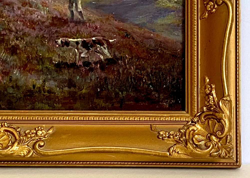 An antique oil painting on canvas depicting a hunter and gundogs in a heather moorland landscape, housed in an ornate gold gilt frame. View VII