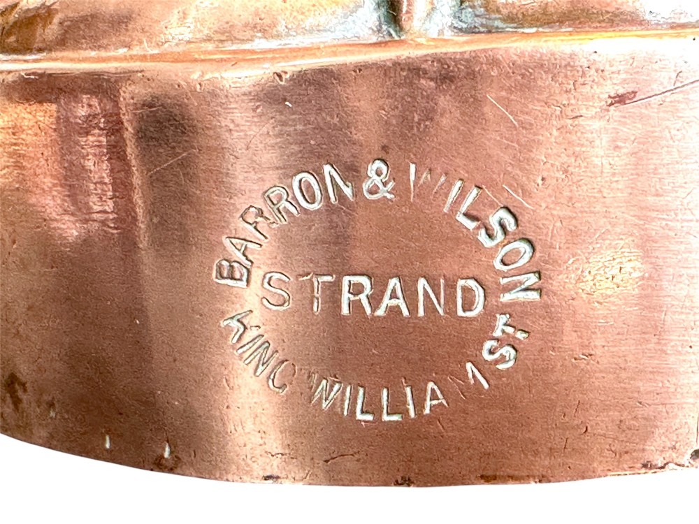 A Victorian stamped copper jelly mould featuring a multi-columned tiered architectural design with a central aperture. View IV