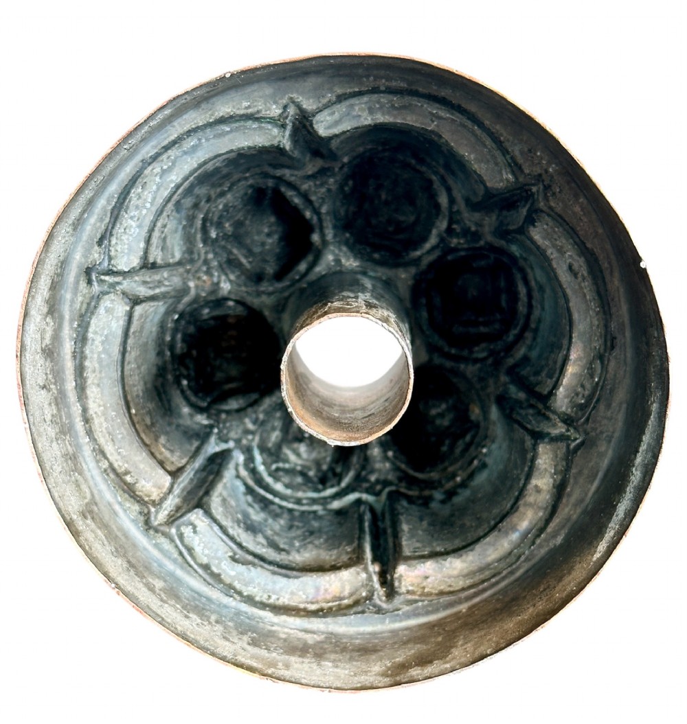 A Victorian stamped copper jelly mould featuring a multi-columned tiered architectural design with a central aperture. View V