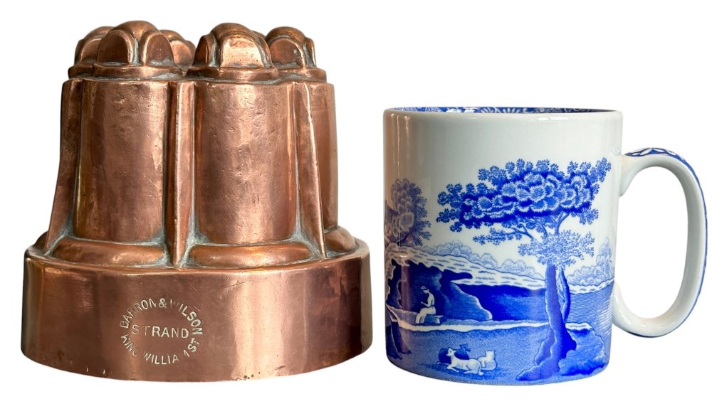 A Victorian stamped copper jelly mould featuring a multi-columned tiered architectural design with a central aperture. View VI