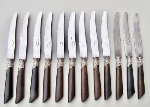 fig 1. SET OF TWELVE 19TH C. FRENCH TABLE KNIVES WITH EBONY HANDLES, SILVER PLATED FERRULES AND STEEL BLADES, CIRCA 1890