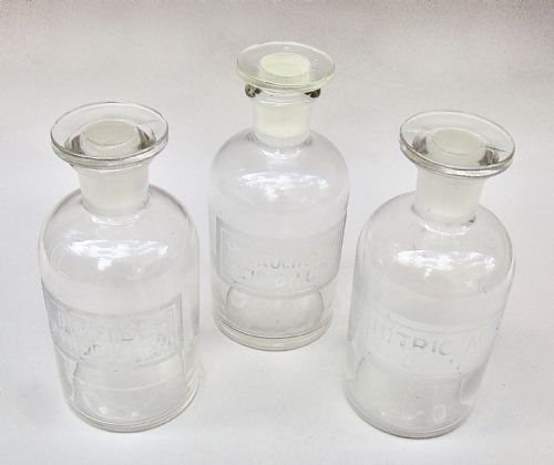 fig 1. UNUSUAL SET OF THREE EARLY 20TH CENTURY ETCHED GLASS CHEMISTRY BOTTLES, CIRCA 1920
