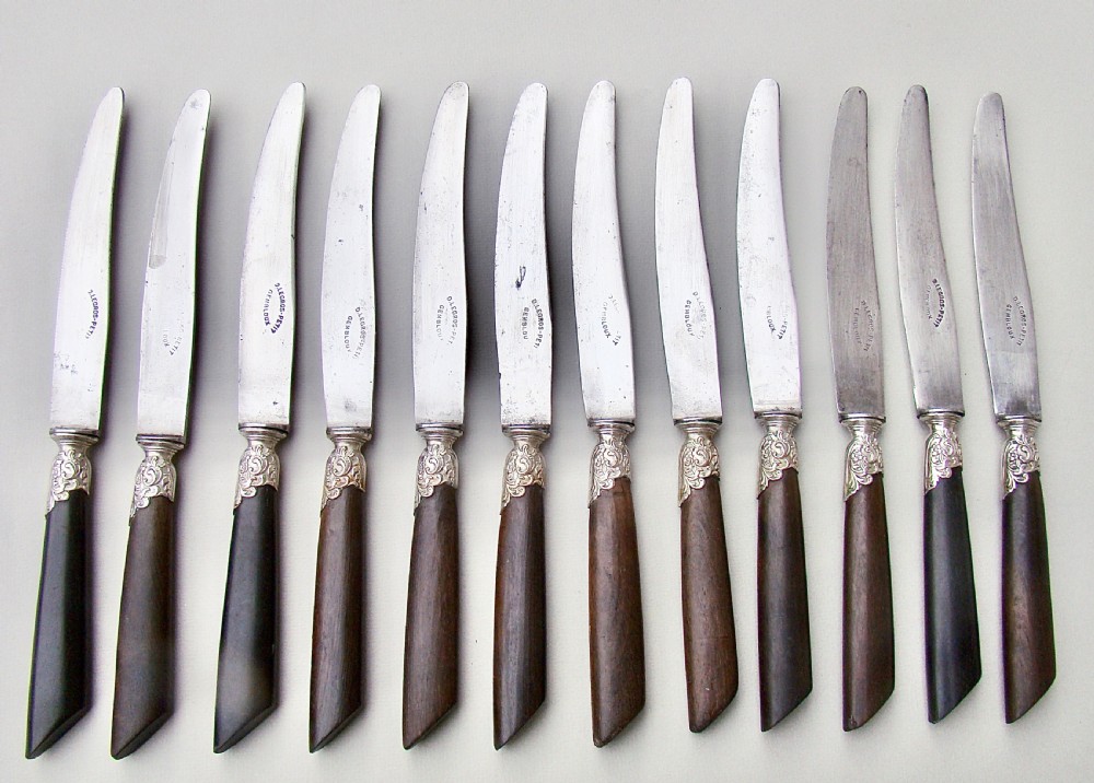 SET OF TWELVE 19TH C. FRENCH TABLE KNIVES WITH EBONY HANDLES, SILVER PLATED FERRULES AND STEEL BLADES, CIRCA 1890
 View II