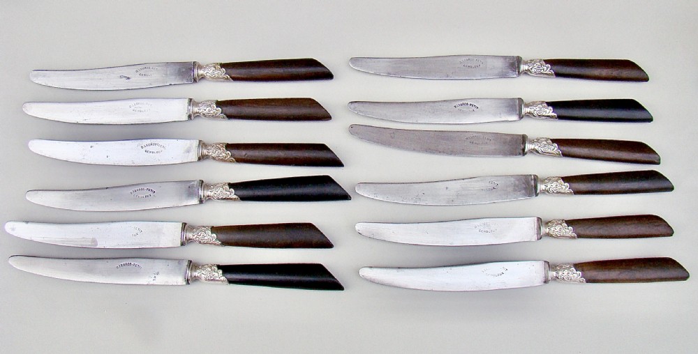 SET OF TWELVE 19TH C. FRENCH TABLE KNIVES WITH EBONY HANDLES, SILVER PLATED FERRULES AND STEEL BLADES, CIRCA 1890
 View III