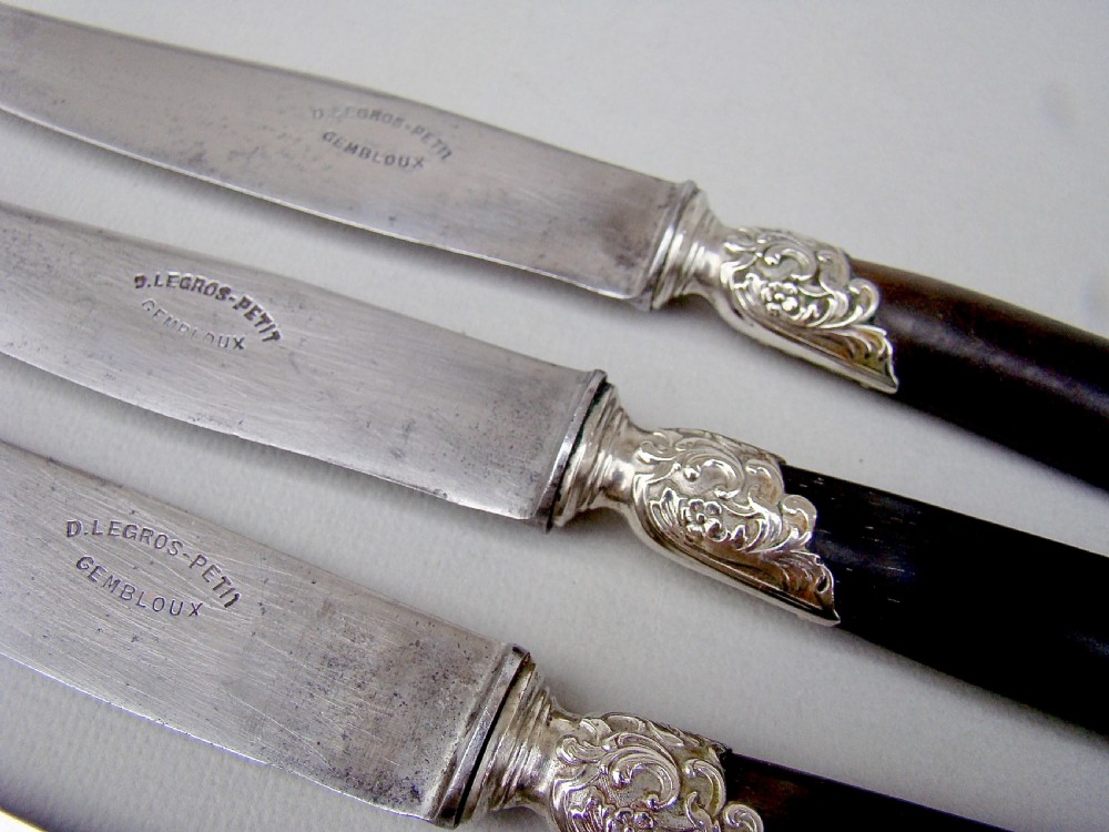 SET OF TWELVE 19TH C. FRENCH TABLE KNIVES WITH EBONY HANDLES, SILVER PLATED FERRULES AND STEEL BLADES, CIRCA 1890
 View V