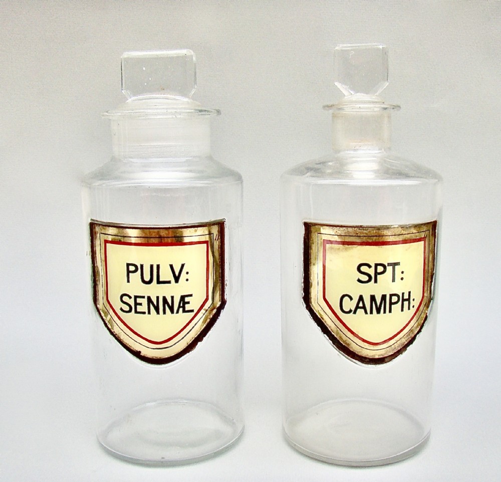 RARE PAIR OF MEDIUM-SIZED VICTORIAN YELLOW LABEL APOTHECARY BOTTLES, CIRCA 1890
