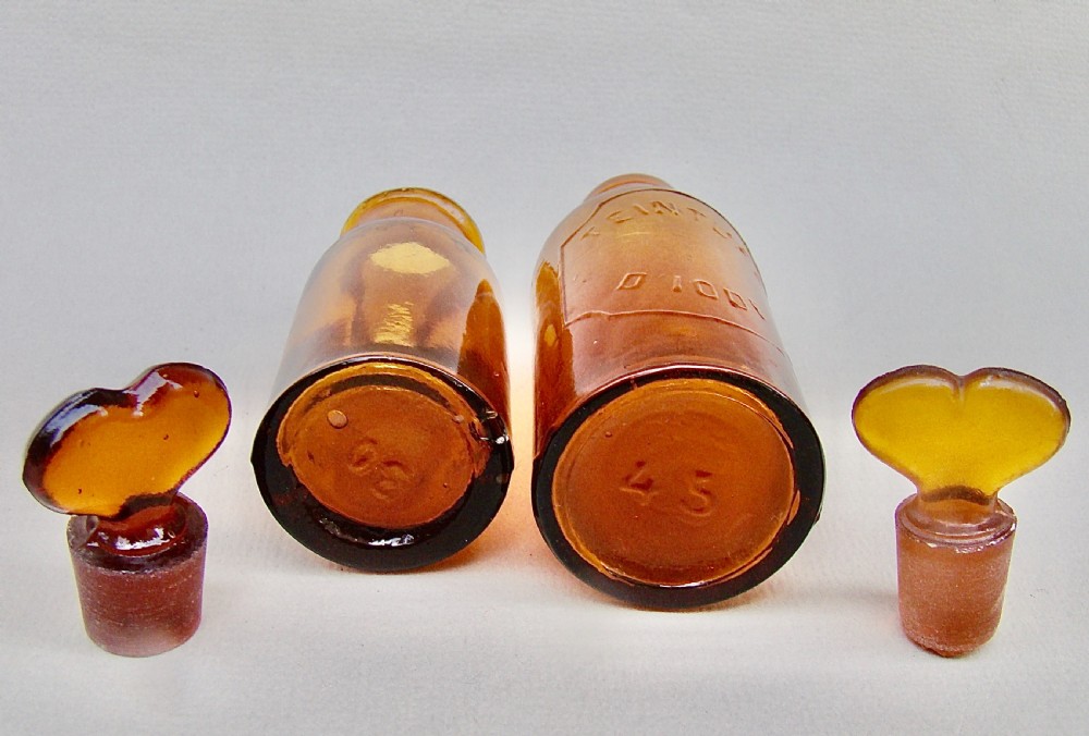CHARMING PAIR OF SMALL 19TH CENTURY FRENCH AMBER GLASS APOTHECARY BOTTLES View V