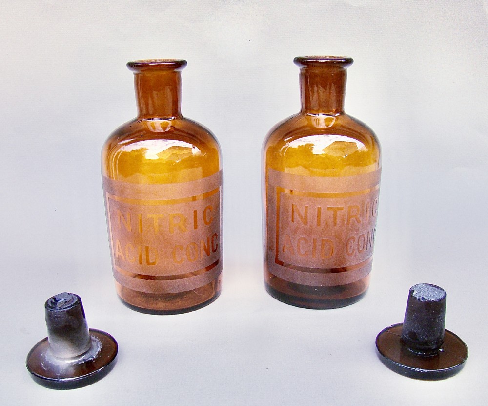 UNUSUAL PAIR OF EARLY 20TH CENTURY AMBER GLASS CHEMISTRY BOTTLES, CIRCA 1920 View III