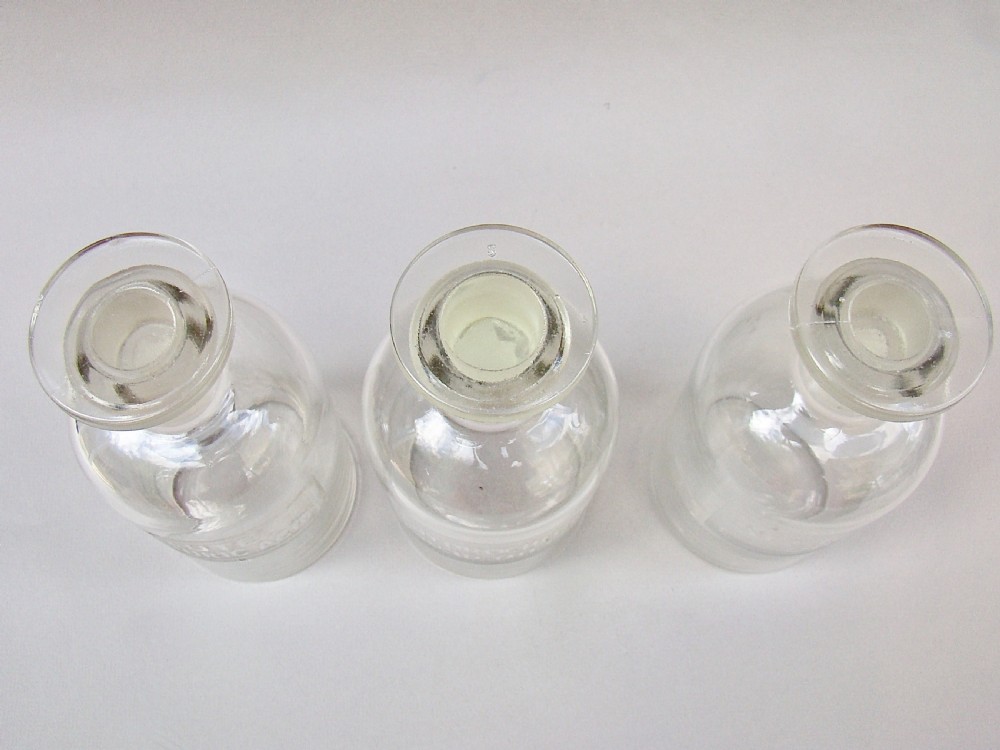 UNUSUAL SET OF THREE EARLY 20TH CENTURY ETCHED GLASS CHEMISTRY BOTTLES, CIRCA 1920
 View III