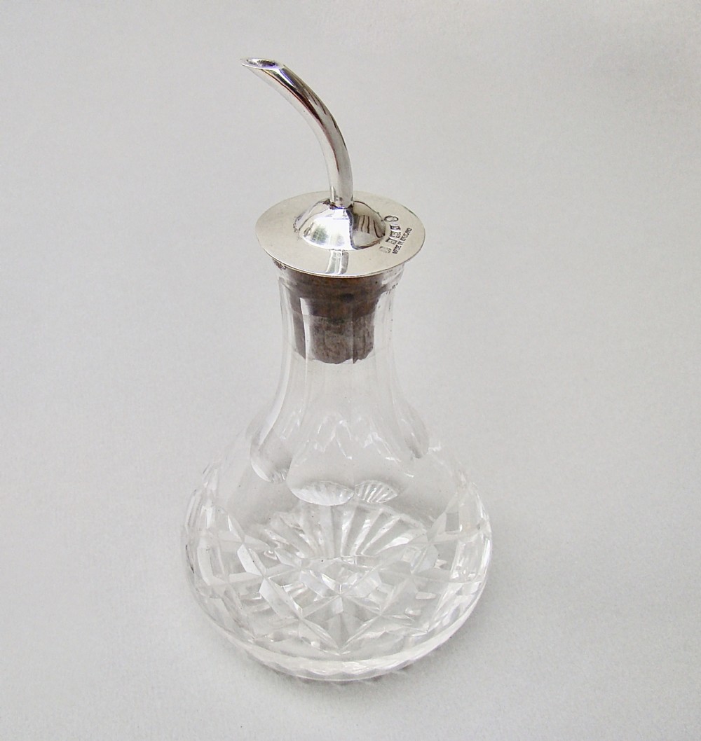 MID-CENTURY SILVER MOUNTED ANGOSTURA BITTERS BOTTLE BY THE ADIE BROTHERS, BIRMINGHAM 1952