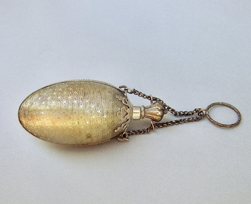 19TH CENTURY FRENCH ORMULU CHATELAINE EGG-SHAPED SCENT BOTTLE, CIRCA 1890