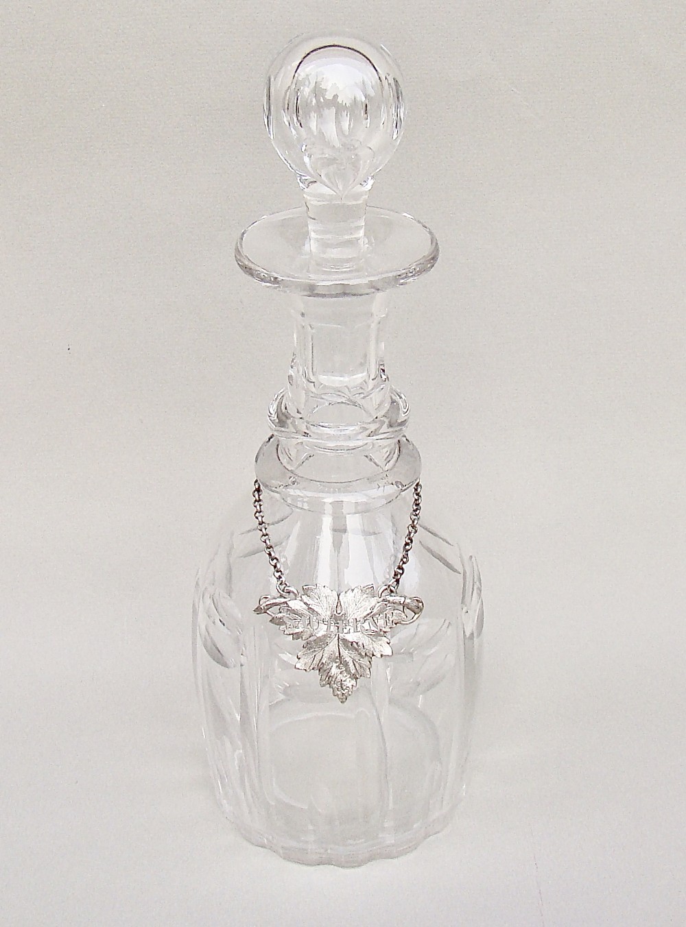 EXQUISITE VICTORIAN CUT GLASS DECANTER WITH A RARE SILVER WINE LABEL FOR SAUTERNE, LONDON 1839
