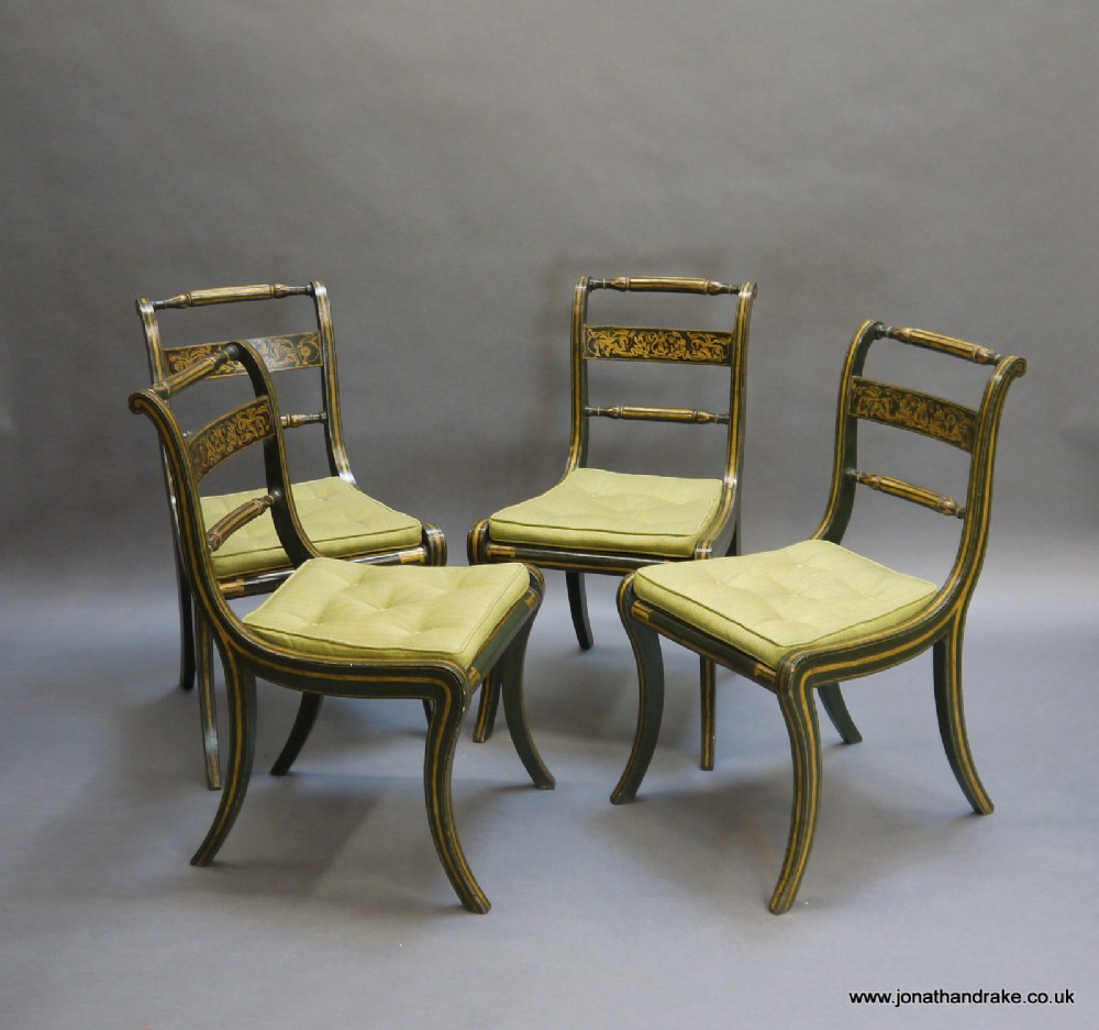 A set of 4 Regency painted and gilt chairs