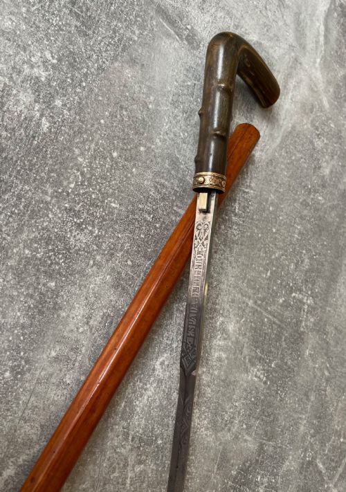 MALACCA SWORD STICK WITH ETCHED TOLEDO BLADE AND BUTTON RELEASE