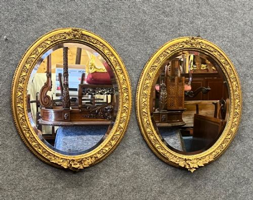 PAIR OF ANTIQUE OVAL MIRRORS
