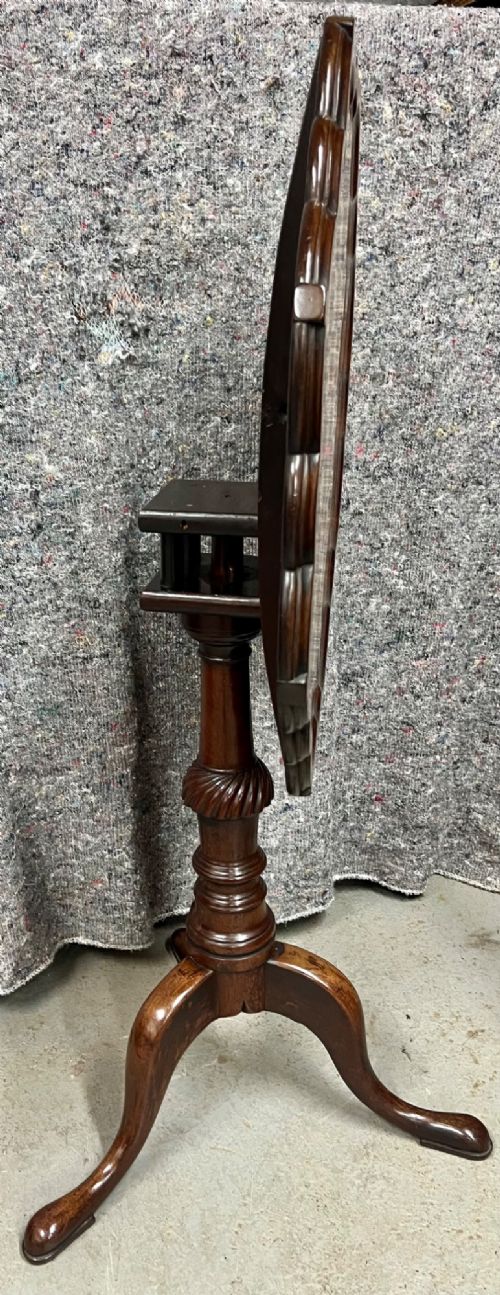 A George III mahogany tripod table featuring a scalloped piecrust rim, an inlaid chessboard top, a turned pedestal, and three cabriole legs. View X