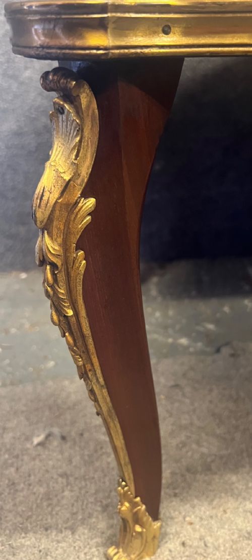 A French Louis XV style coffee table featuring a floral marquetry tray top with brass gallery rim, handles, and gilt metal mounts on curved cabriole legs. View VIII