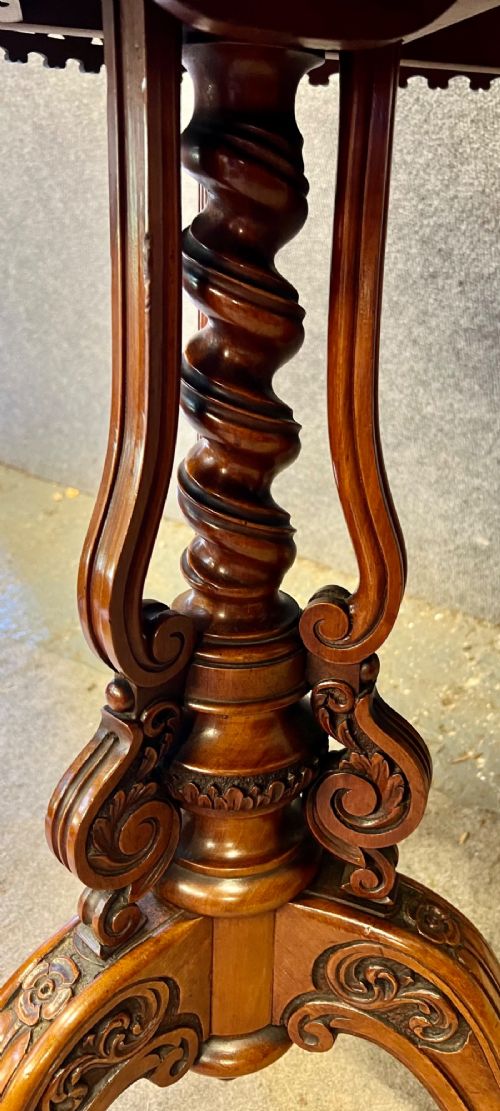 A 19th-century hexagonal specimen wood table featuring a geometric optical illusion parquetry top set on a carved central pedestal base. View IX
