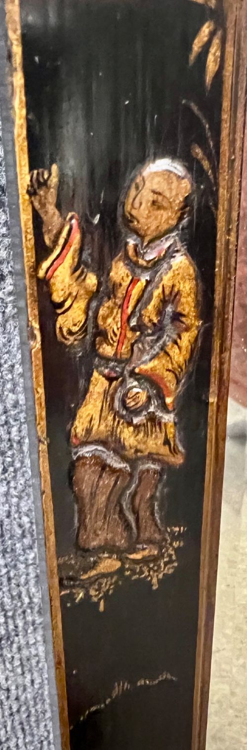 A tall, narrow black lacquered hall mirror decorated with gilded Chinoiserie pagodas and figures, featuring an arched top and front cabriole legs. View VI