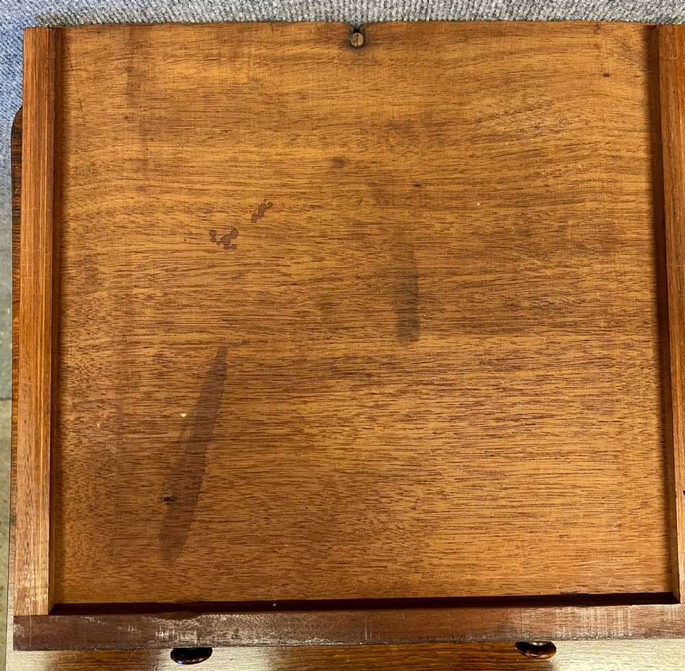 A four-tier rosewood whatnot featuring an adjustable angled top reading slope, fluted supports, a bottom drawer, and brass castors. View VIII