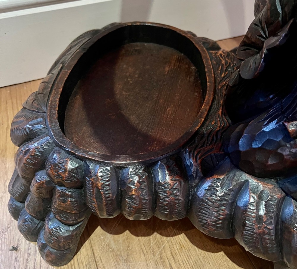 A tall dark wood hand-carved Black Forest hall stand featuring climbing bear figures, branch-form coat pegs, and an integrated umbrella ring with a drip pan base. View VIII