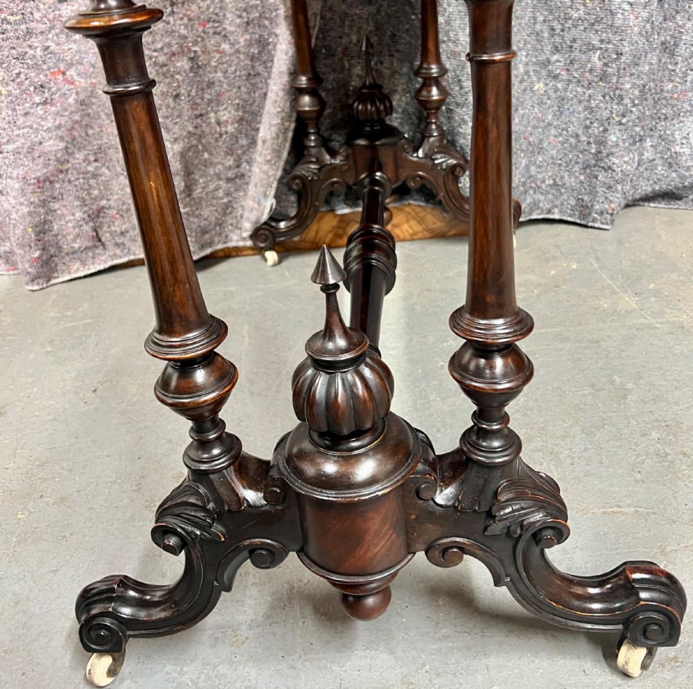 A Victorian burr walnut card table featuring geometric Tunbridge Ware inlay, turned twin-column supports, and a stretcher base on castors. View IX