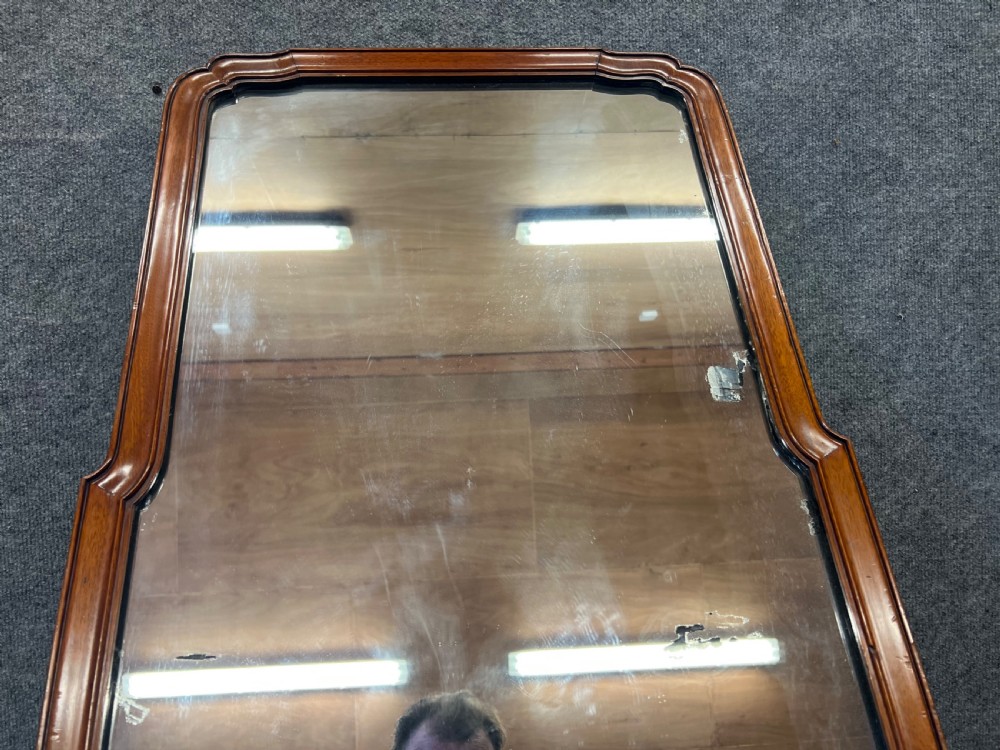 A tall antique mirror featuring a moulded mahogany frame with a curved top arch. View VI