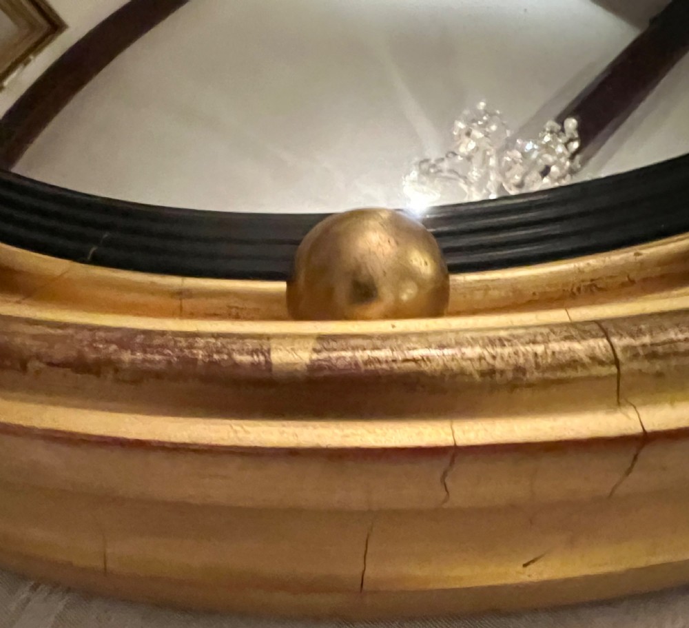 Regency Style Convex and gilded Mirror View III