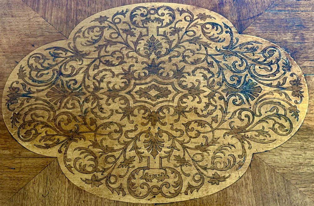 A square walnut Queen Anne style coffee table featuring an inlaid central marquetry medallion, a raised tray rim, and curved cabriole legs ending in pad feet. View VIII
