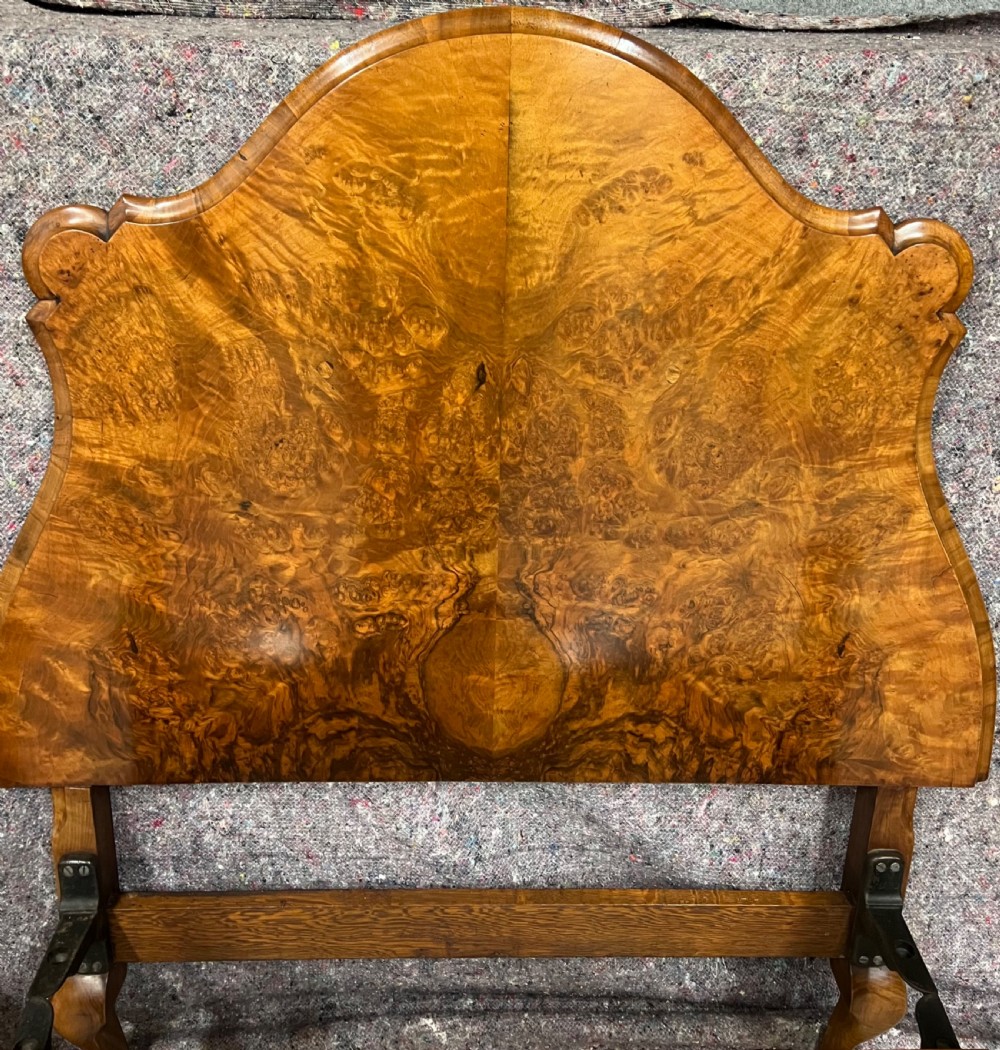 A pair of Queen Anne style single bed frames crafted from figured walnut with arched headboards, scrolled footboards, and cabriole legs. View XI